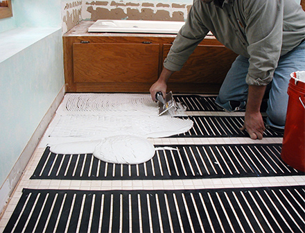 Thinset being applied over the heating element.