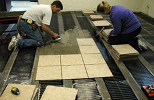Installing a low-voltage floor heating system for a heated tile floor.